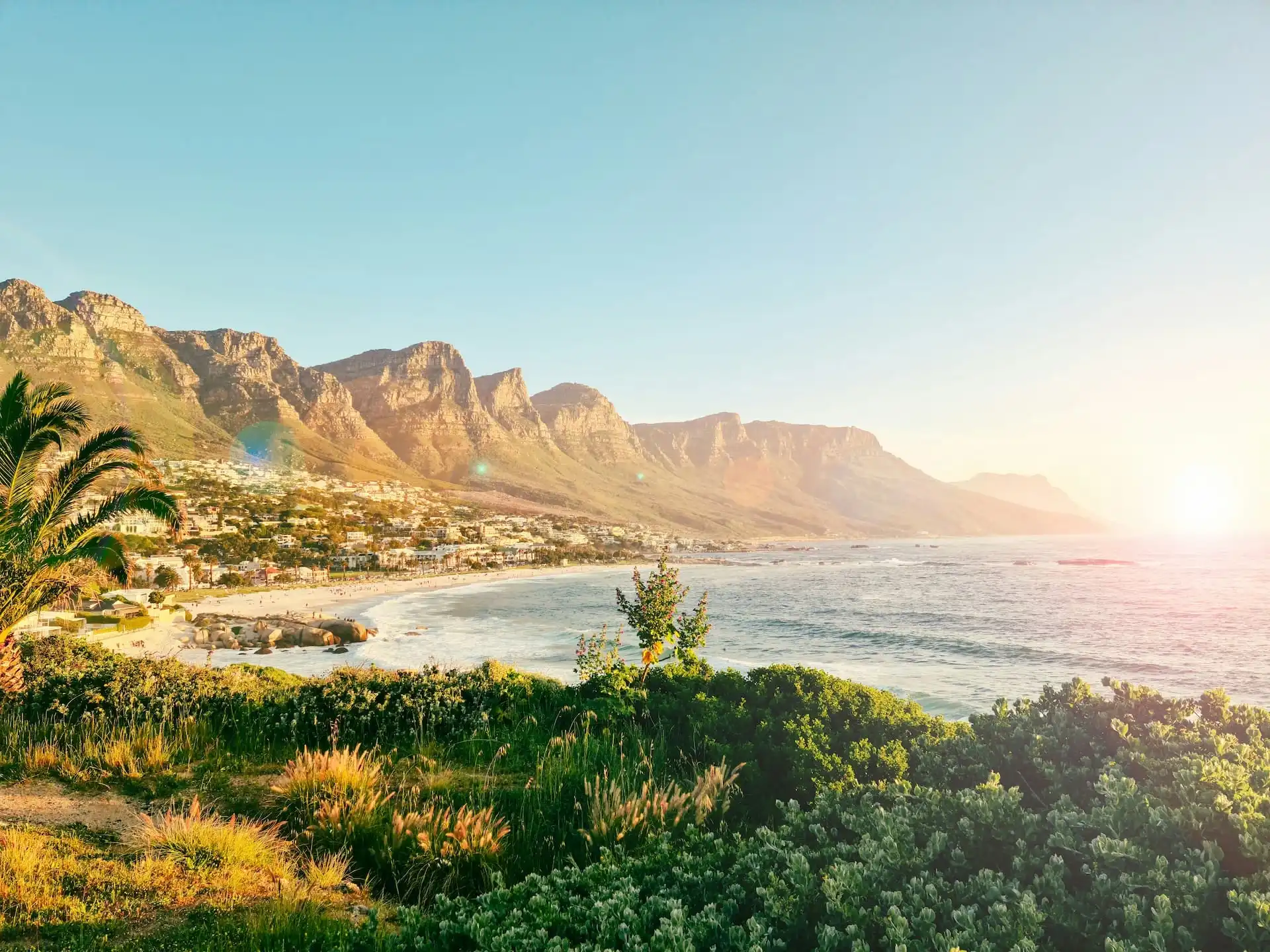Sunset view over Camps Bay and the Twelve Apostles mountain range in Cape Town